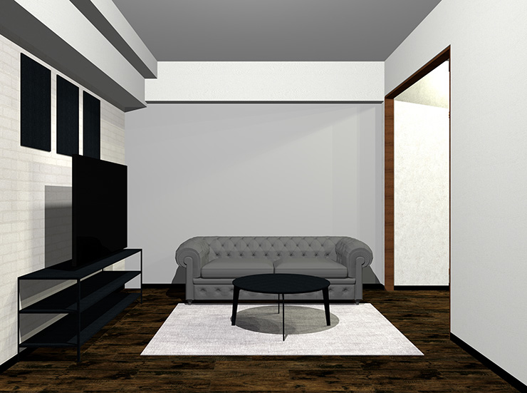 暗いグレーのソファと黒の家具